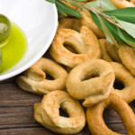 Taralli biscuit with ingredients on the wood table